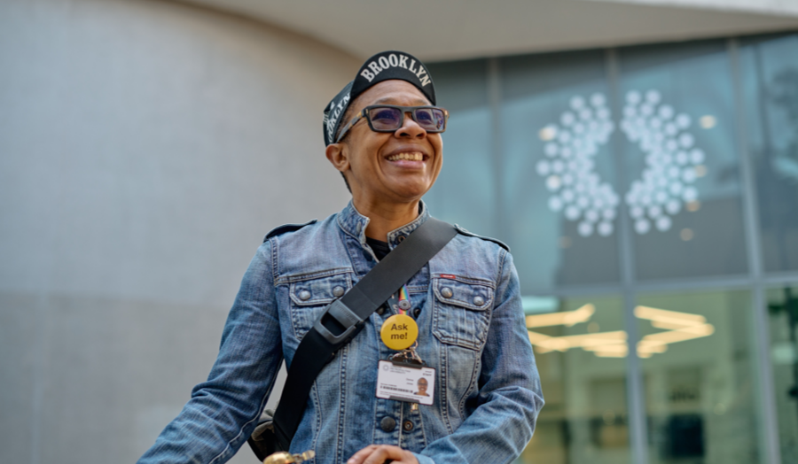 A person on a bicycle standing outside London Metropolitan University’s Holloway campus
