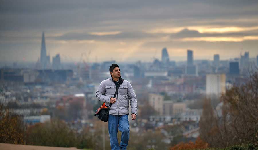 Lakruwan walking up a very misty Parliament Hill