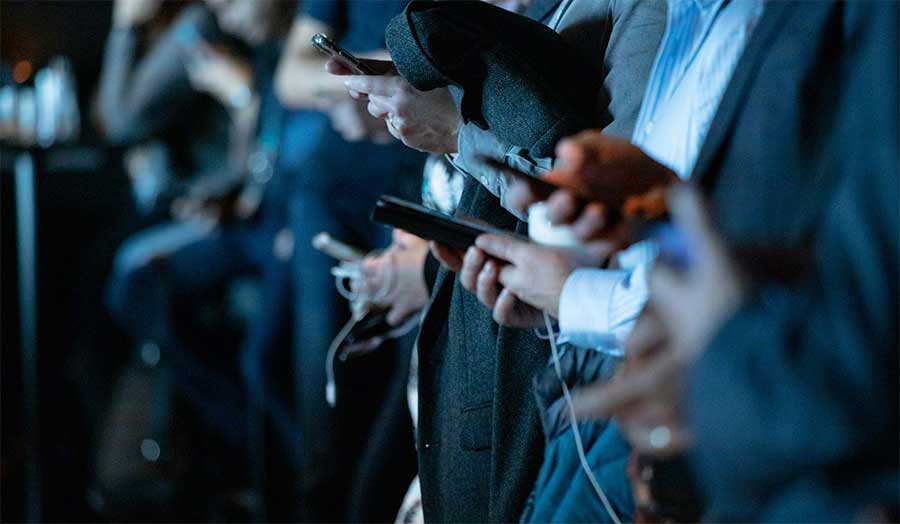 People looking at their phones