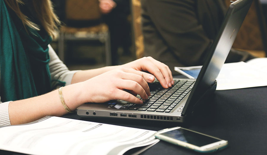 Student using laptop stock image