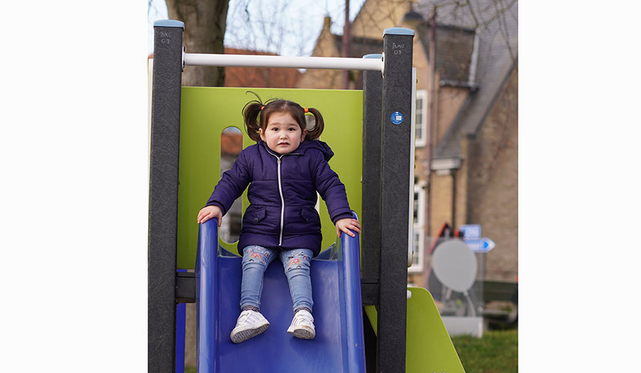 Afghan girl on a slide
