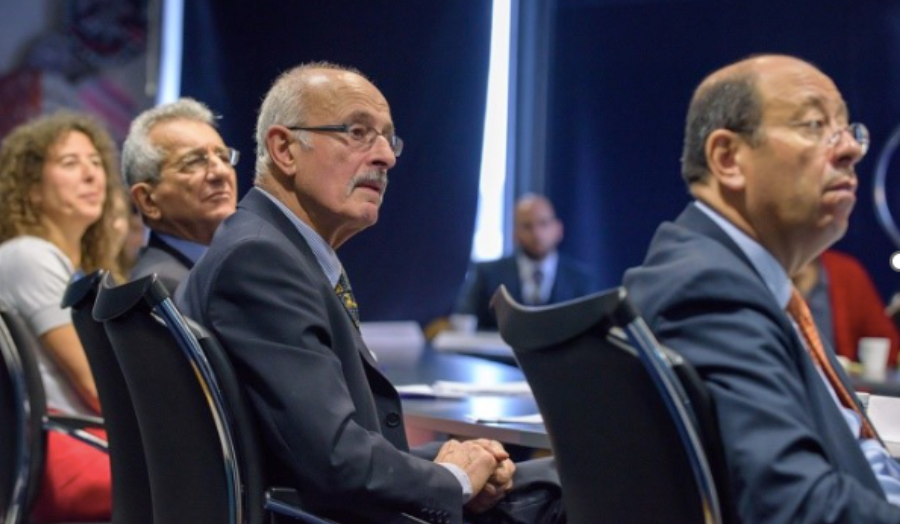 Dr Alicia Chrysostomou, Mr Anastasios Leventis, Prof John Charalambous and H.E. Euripides Evriviades listening to a conference speaker. 
