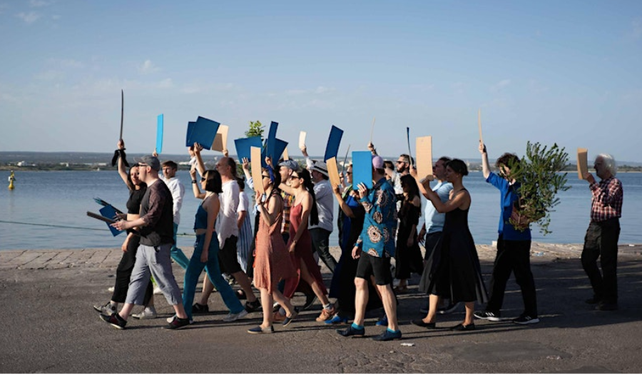 Group of people walking on the waterfront. 