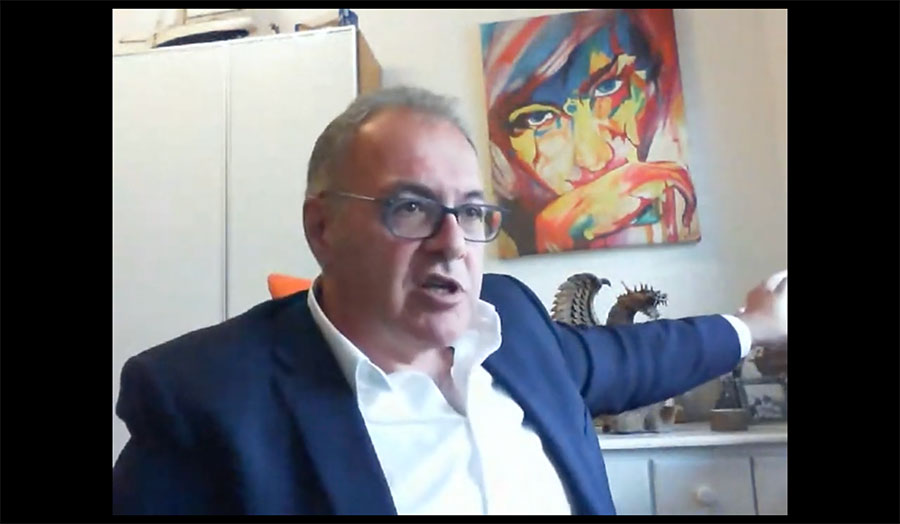 professor Umit Bititci giving an online lecture from his office