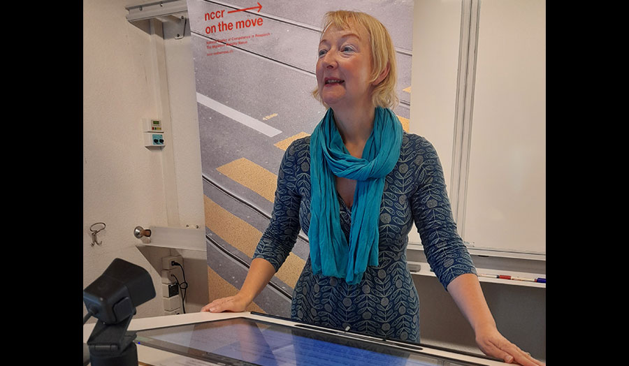 Louise Ryan stands at a lectern